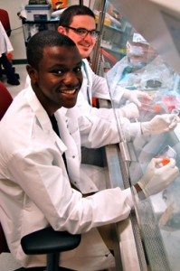 Justin Hills ‘14 in the lab at St. Jude Children’s Research Hospital with graduate student mentor Jordan Beard