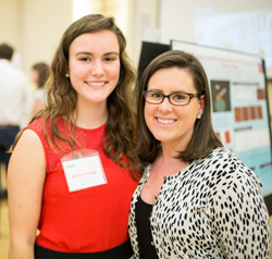 Kati Scruggs ‘18 and Natalie Cooke ‘10 at NC State’s Spring 2016 Undergraduate Research Symposium – Photo © Thomas Crocker