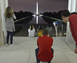 Members of the Class of 2019 gaze at the Washington Monument from the steps of the Lincoln Memorial