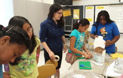 As an intern with Cabarrus County Schools, Ashley Lawson '18 (center) assisted with summer STEM and reading camps. Here, she worked with students in the Summer Bridge program to construct model shipping container homes. – Summer 2015