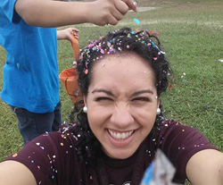 Jezzette Rivera ’10 celebrating a south Texas Easter tradition wherein participants crack confetti-filled egg shells upon one another’s heads.